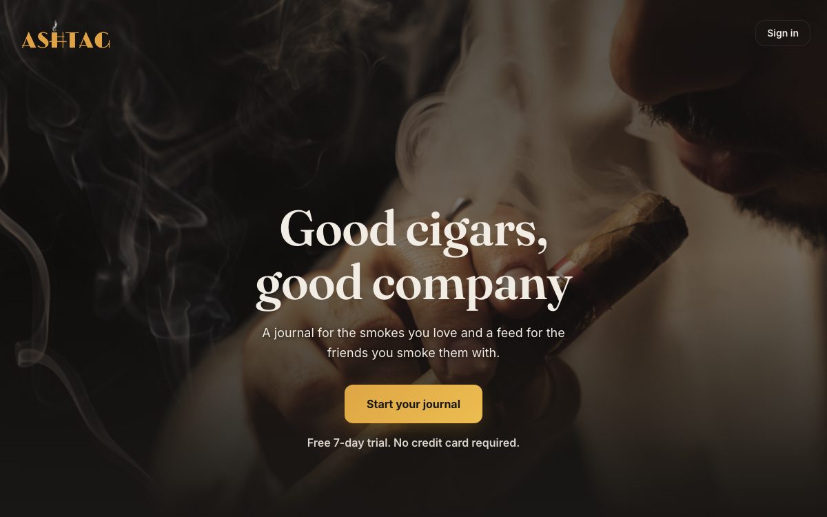 AshTag homepage: a lit cigar on dark wood, "Good cigars, good company"